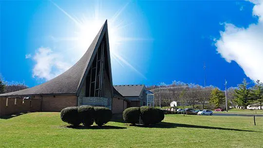 Sunburst behind Zion Evangelical Lutheran Church Dayton, OH, exterior.